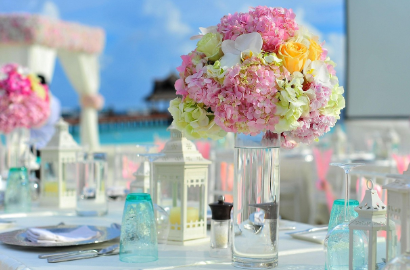 florist team arranging centrepiece backstage